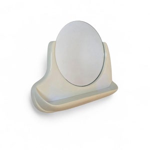 Vintage bathroom mirror with shelf  in a plastic