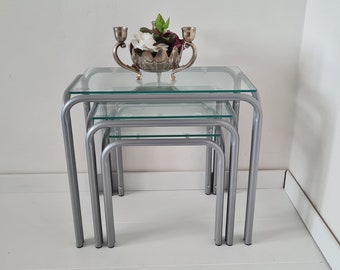 Vintage Mid Century Modern Nesting Table Set of 3 Silver colored coated frame and Hardened glass table tops Unused in original box
