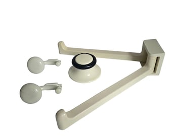 May include: White plastic kitchen organizer with two hooks and a suction cup base. The organizer is folded into a triangular shape.