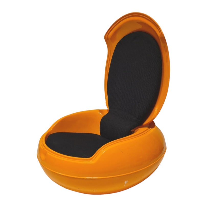 May include: A bright orange egg-shaped chair with a black fabric cushion and a hinged back.