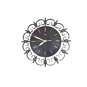 Vintage Mid Century  German metal Wall clock with a new clockwork