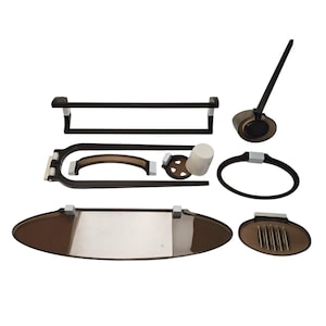May include: A set of bathroom accessories in a modern style. The set includes a towel rack, a soap dish, a toothbrush holder, a tumbler, a soap dispenser, a tray, and a ring-shaped holder. The pieces are dark brown with silver accents.