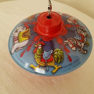 Vintage small Spinning top toy with image carousel Traditional whirligig