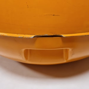 May include: Orange enamel cast iron pot with a small chip on the rim.