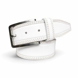 May include: A white leather belt featuring double-row decorative stitching along the edges and a rectangular brushed metal buckle. The belt is coiled, showing the strap with two adjustment holes and a matching white leather keeper loop.