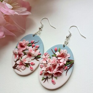 Cherry Blossom featuring beautiful white and pink bloom of cherry flowers. The earrings are handmade from lightweight polymer clay