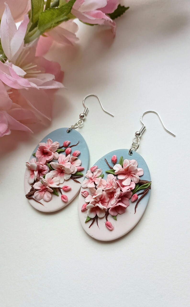 Cherry Blossom featuring beautiful white and pink bloom of cherry flowers. The earrings are handmade from lightweight polymer clay