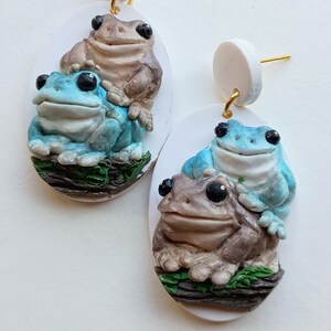 Handmade polymer clay earrings featuring frog stack design