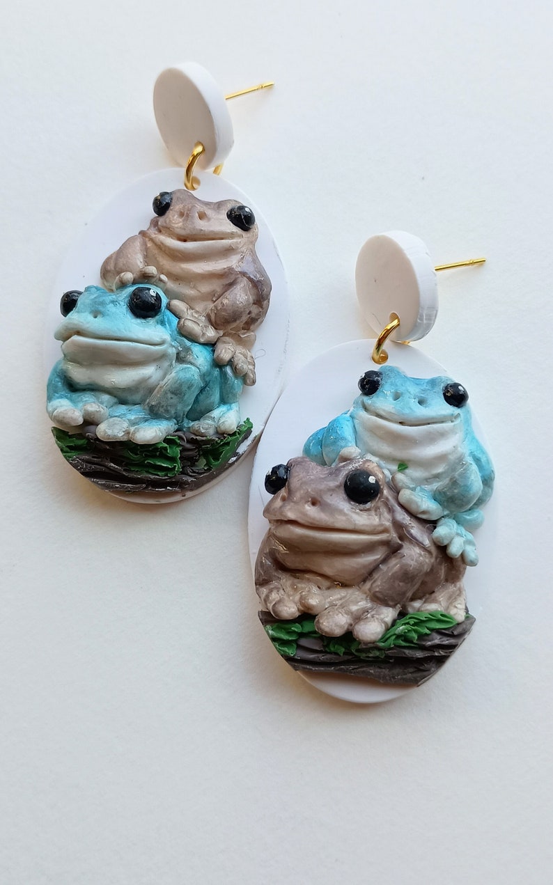Handmade polymer clay earrings featuring frog stack design