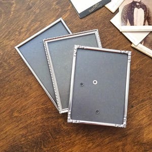 Set of three vintage photo frames | Silver plated photo frames 9x12 and 9x13 cm | Vintage picture frames | Vintage Jyden frames