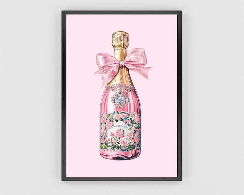 May include: A pink champagne bottle with a gold label and a pink bow. The bottle is decorated with floral designs and has a gold stopper.