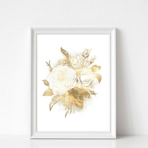 May include: A framed art print featuring a watercolor illustration of white roses and gold leaves. The floral arrangement is set against a white background, with a white frame. The artwork has a soft, elegant aesthetic.