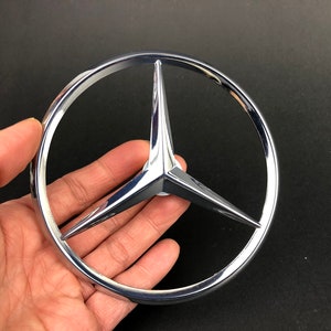 Genuine Mercedes Benz Rear Trunk Emblem Replacement Part #1267580058.  Vintage New Old Stock. 4.5” (11.5cm) Diameter.