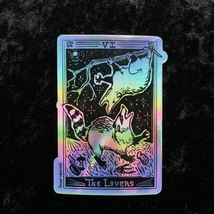 Appalachian Tarot: Possum and Raccoon Fighting Over Trash - The Lovers Holographic Sticker