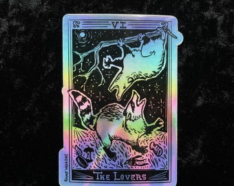 Appalachian Tarot: Possum and Raccoon Fighting Over Trash - The Lovers Holographic Sticker