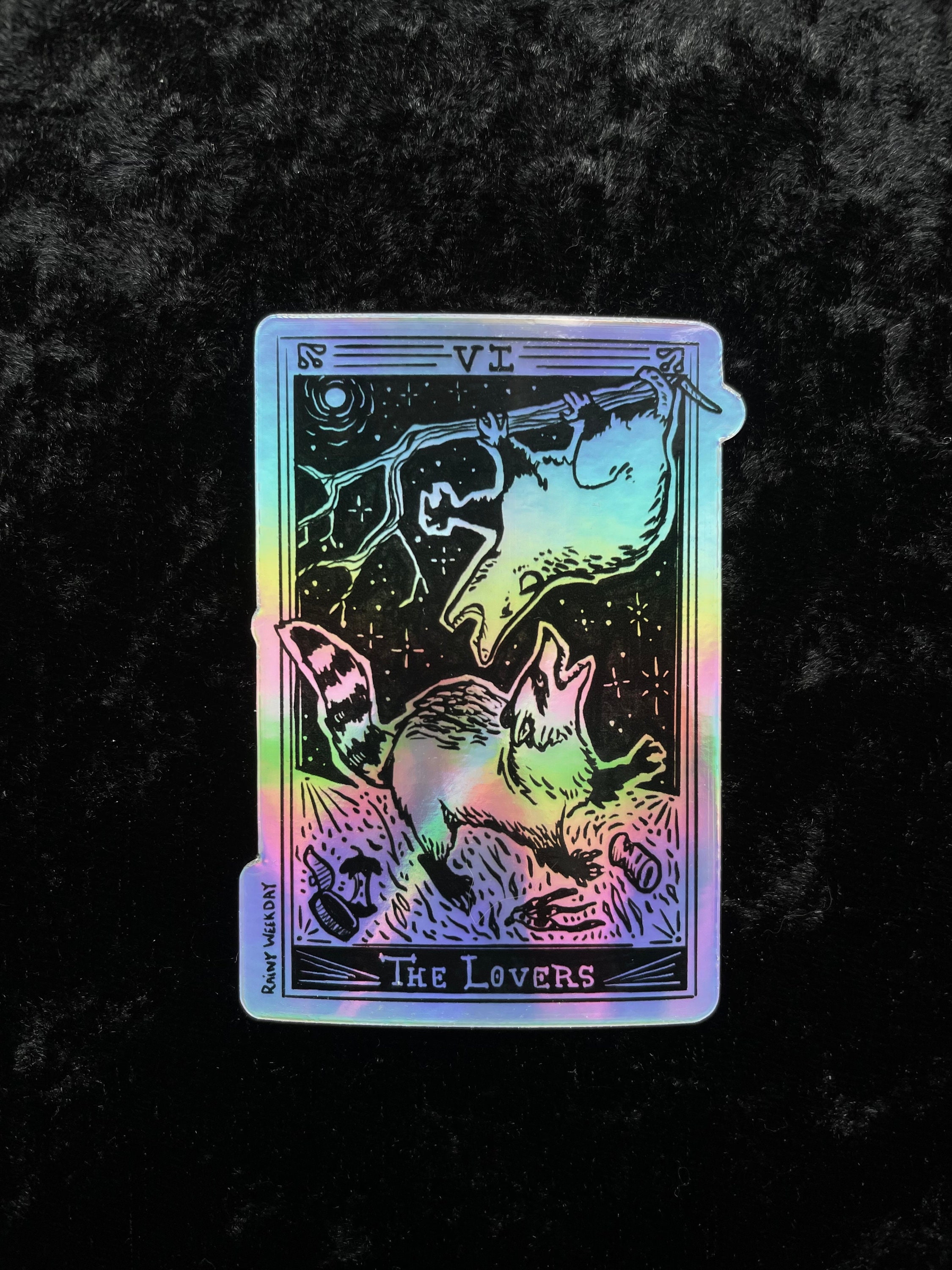Appalachian Tarot: Possum and Raccoon Fighting Over Trash - The Lovers Holographic Sticker