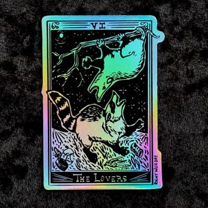 Appalachian Tarot: Possum and Raccoon Fighting Over Trash - The Lovers Holographic Sticker