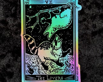Appalachian Tarot: Possum and Raccoon Fighting Over Trash - The Lovers Holographic Sticker