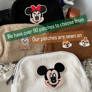 May include: Three fluffy fabric bags with different Disney character patches. The bags are brown, black and white. The text on the bags reads "We have over 90 patches to choose from. Our patches are sewn on."