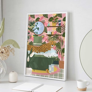 May include: A framed illustration of a jungle scene with a leopard in a bathtub surrounded by lush green plants and pink flowers. The bathtub is filled with bubbles and there are bottles of bath products on the ledge.
