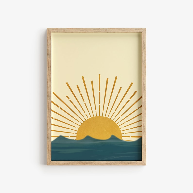 May include: A framed print with a minimalist design featuring a yellow sun rising over a blue ocean. The sun has a stylized sunburst design.