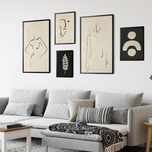 May include: Five black framed minimalist line art prints on a white wall. The prints feature a human figure, a face, a branch, and a geometric shape.