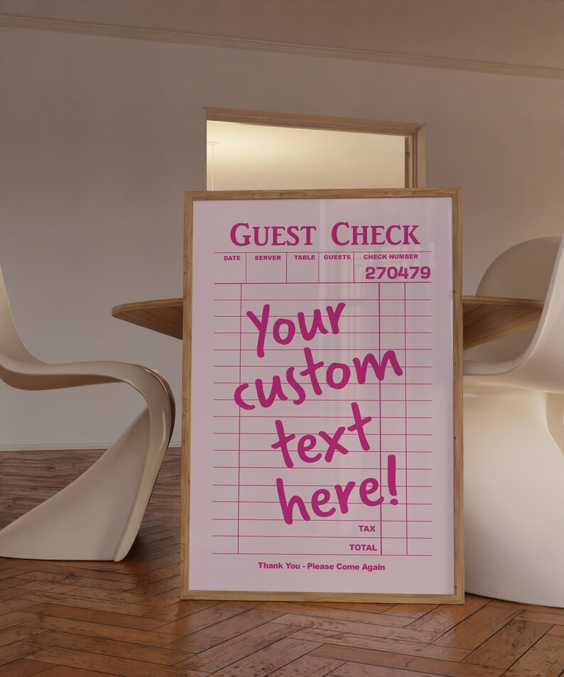 May include: A pink and white guest check with the text "GUEST CHECK" and "Your custom text here!" on a wooden frame. The check number is 270479.