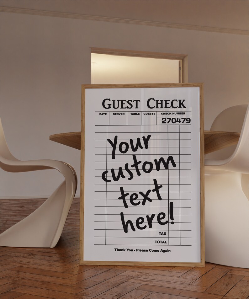May include: A white guest check with black text and lines. The text says "GUEST CHECK", "DATE", "SERVER", "TABLE", "GUESTS", "CHECK NUMBER", "270479", "Your custom text here!", "TAX", "TOTAL", and "Thank You - Please Come Again".