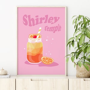 May include: A pink printable poster with the text "Shirley Temple" in a retro font. The poster features a cartoon illustration of a mason jar filled with a layered orange and yellow drink with a cherry and orange slice on top. A straw is sticking out of the drink.