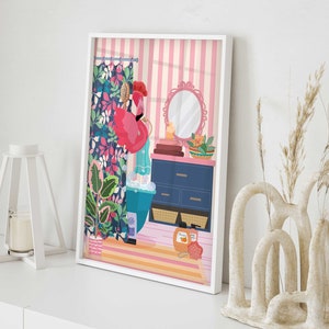 May include: A pink flamingo taking a bath in a blue bathtub with bubbles. The bathroom has a floral shower curtain, a blue vanity with drawers, and a round mirror. There are towels, a bowl of fruit, and a bottle of shampoo on the vanity.