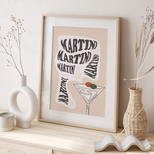 May include: A beige poster with the word "MARTIN" repeated in a swirling, psychedelic font. A martini glass with an olive and a cherry is depicted in the centre of the poster.