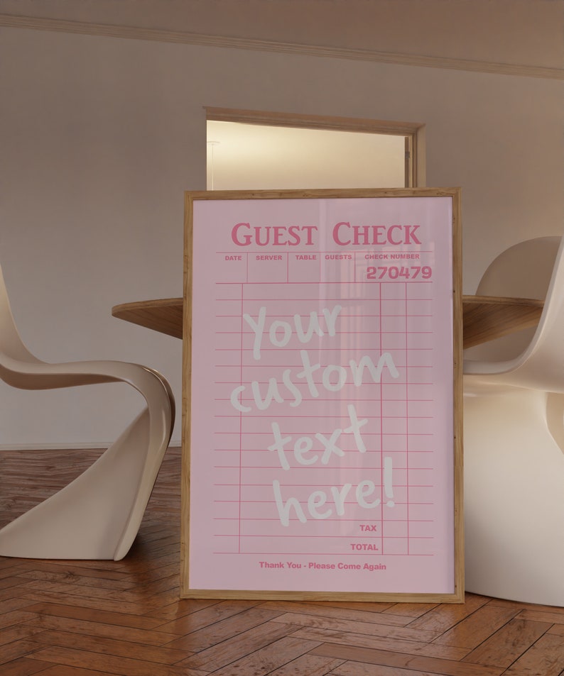 May include: A pink guest check with a wooden frame. The check has a grid pattern and the text "GUEST CHECK" at the top. The text "Your custom text here!" is written in white on the check. The check number is 270479.