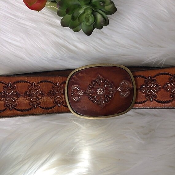 Handmade leather belt with floral design and metal buckle