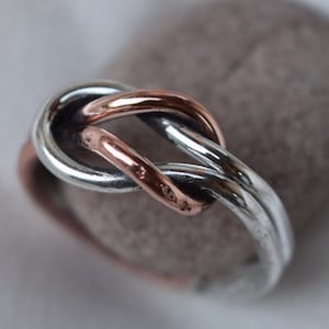 love knot ring in copper and silver