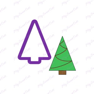 May include: Two Christmas tree cookie cutters. One is a simple outline of a tree, the other is a green tree with red lights and a brown trunk.