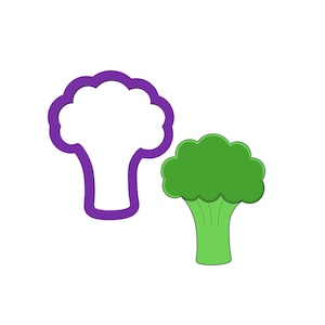 May include: A purple cookie cutter in the shape of a broccoli floret, next to a green cartoon broccoli floret.
