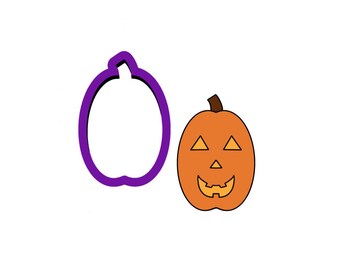 May include: A purple pumpkin cookie cutter and an orange pumpkin with a carved jack-o'-lantern face.
