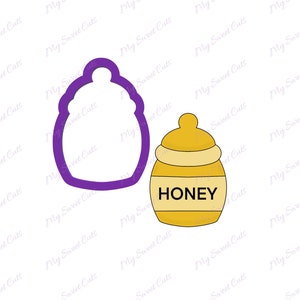May include: A purple cookie cutter shaped like a honey pot with a lid. A yellow honey pot with a white lid and the word "HONEY" printed on the front.