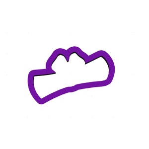 May include: A purple cookie cutter in the shape of a cowboy hat. The cutter has a thick outline and a simple design, perfect for creating themed cookies or treats. The image is set against a plain white background.