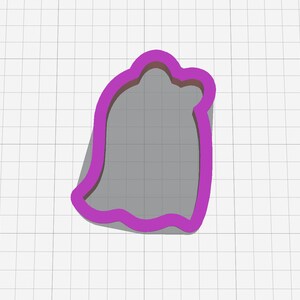 May include: A purple plastic cookie cutter shaped like a ghost with a rounded top and a wavy bottom.