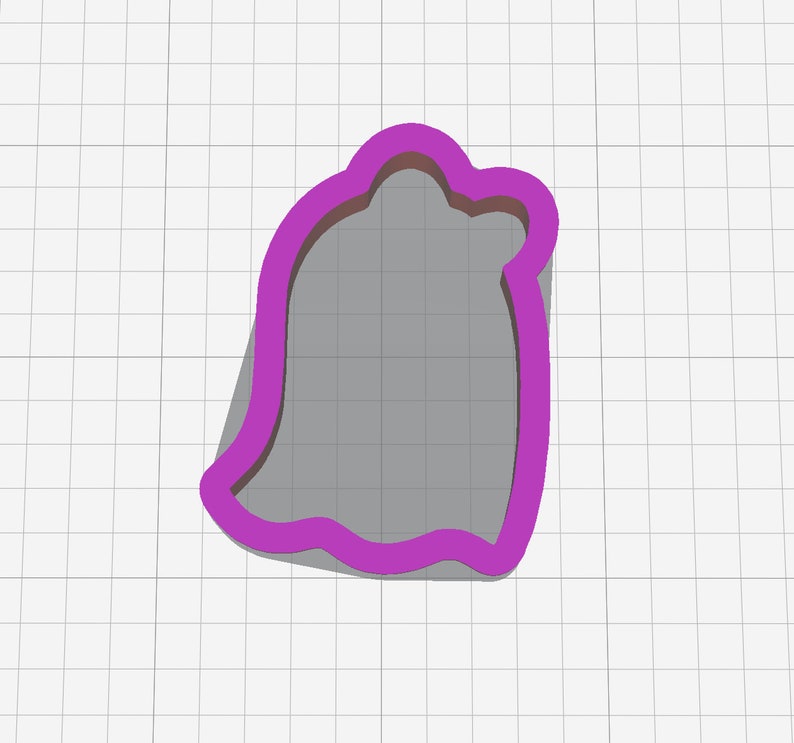 May include: A purple plastic cookie cutter shaped like a ghost with a rounded top and a wavy bottom.