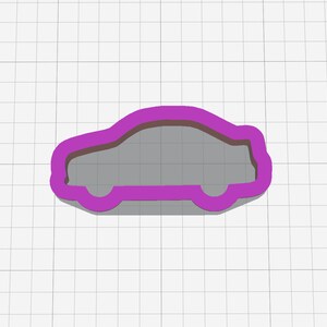 May include: Purple plastic cookie cutter shaped like a car.