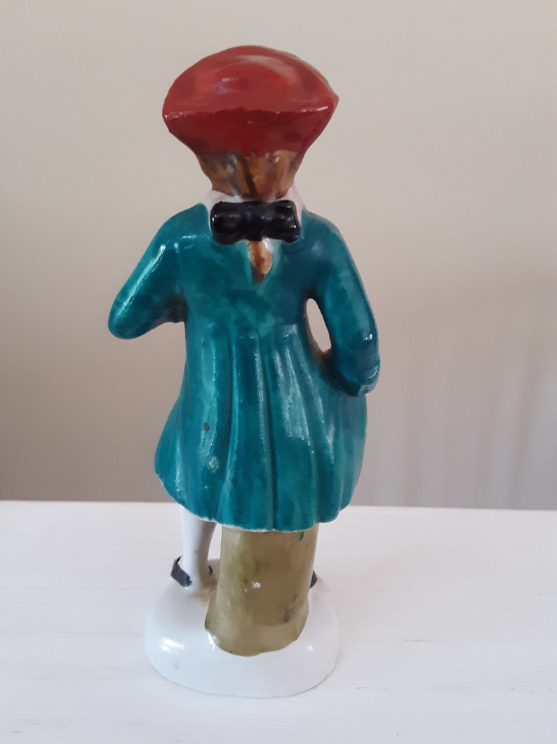 Handpainted Japan Colonial Man Carrying a Bouquet of Flowers
