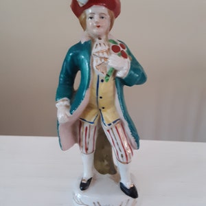 Handpainted Japan Colonial Man Carrying a Bouquet of Flowers