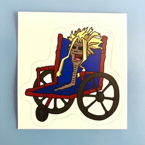 May include: A sticker featuring a cartoon character in a wheelchair. The character has spiky blonde hair and a skeletal face. The wheelchair is blue with red and black accents. The sticker is on a white background.