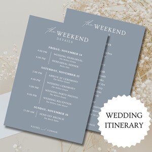 May include: Two blue-gray wedding itinerary cards with white text, featuring event details and times. The cards are labeled "The Weekend" and "Wedding Itinerary". Delicate white flowers are in the background.