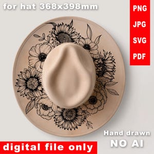 May include: A beige fedora hat with a wide brim, adorned with a black floral design featuring sunflowers and other blooms. The text "digital file only" is visible. The hat is hand drawn.
