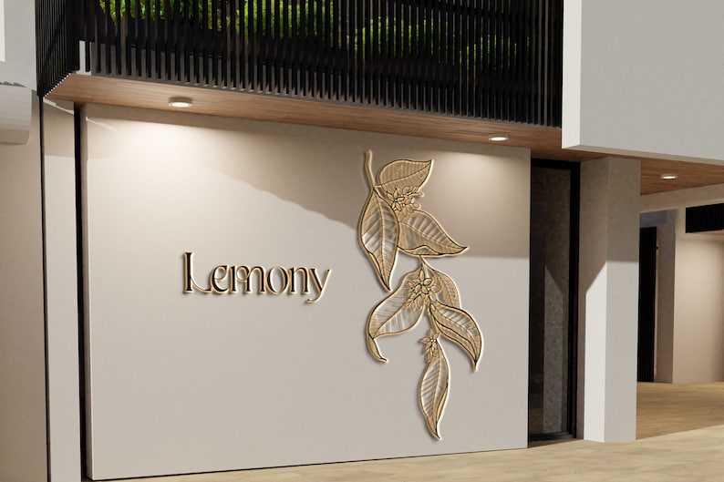 Pu&ograve; includere: Una vetrina bianca con un cartello dorato che recita "Lemony" e un disegno di foglie dorate sul muro.