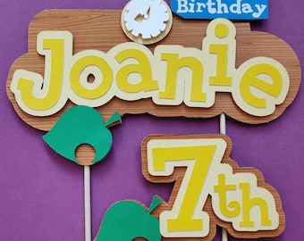 AC video game cake topper, logo sign