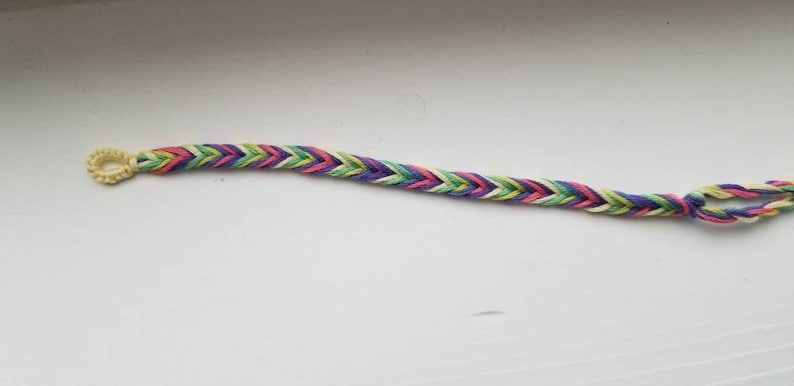Thin colorful handmade knotted daisy chain friendship bracelets